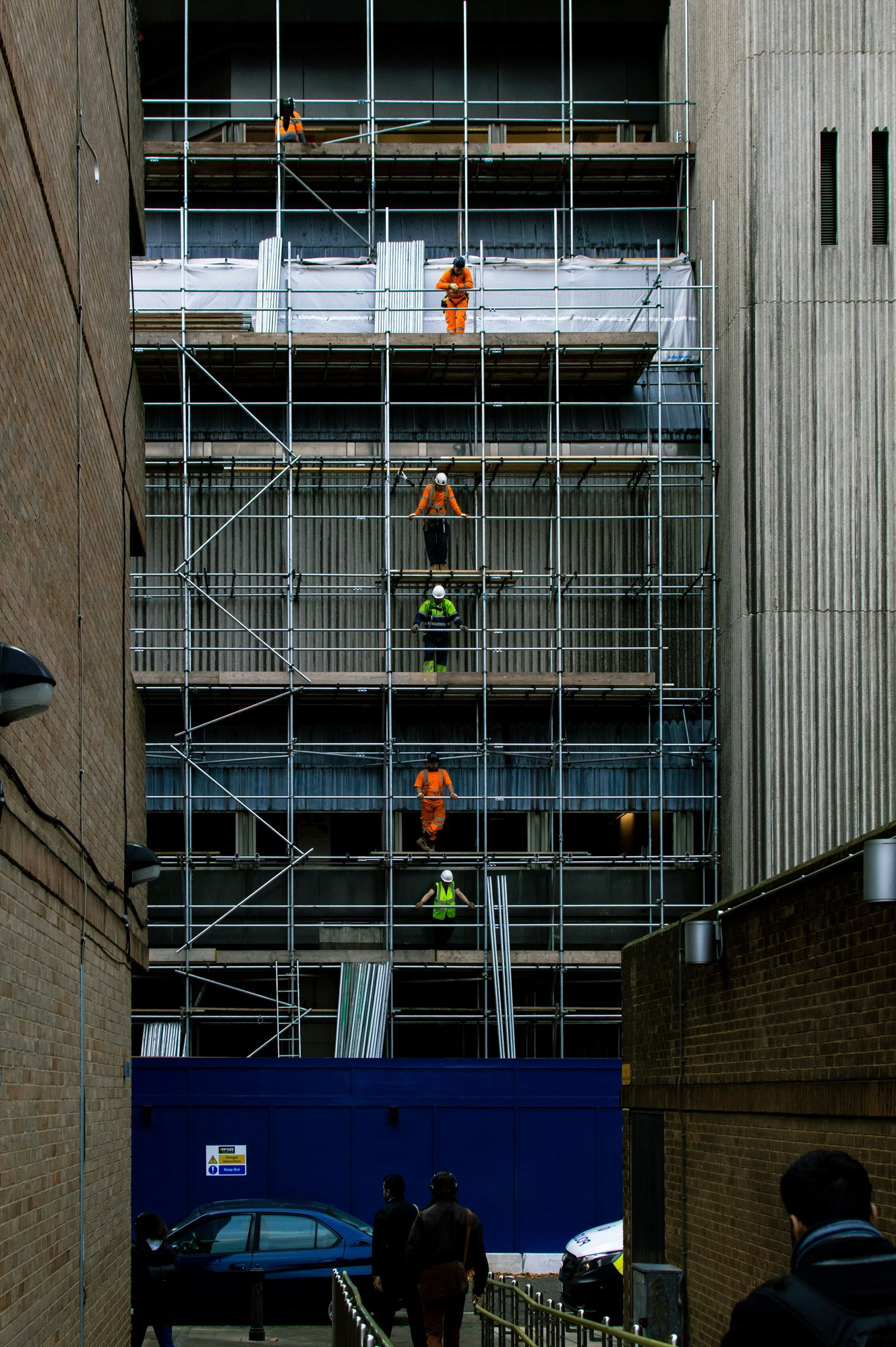 Building with workmen UK