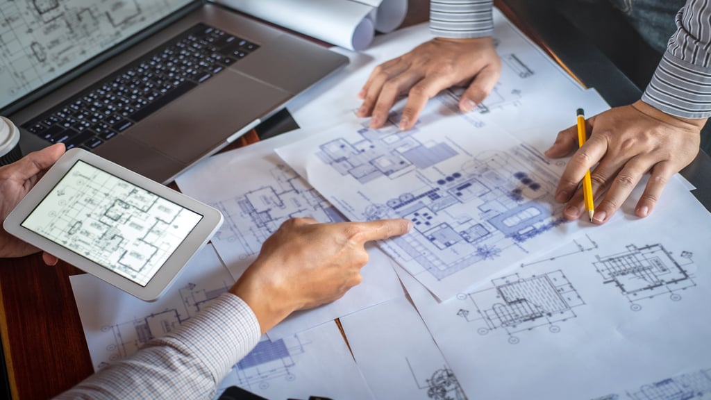 Fingers Pointing At Project Drawings